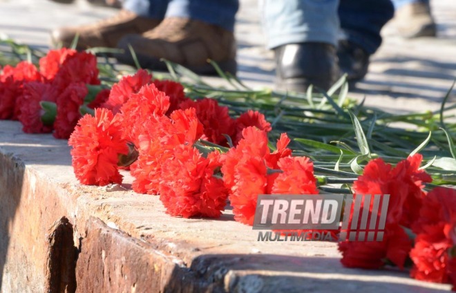 Baku residents bringing flowers to Seaside Boulevard to honor missing oil workers.  Azerbaijan, Dec.07, 2015